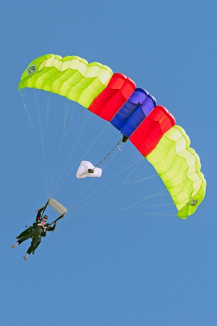 Air Force Veteran and Airshow sponsor Bill Trent jumps alongside the Special Forces Parachute Team